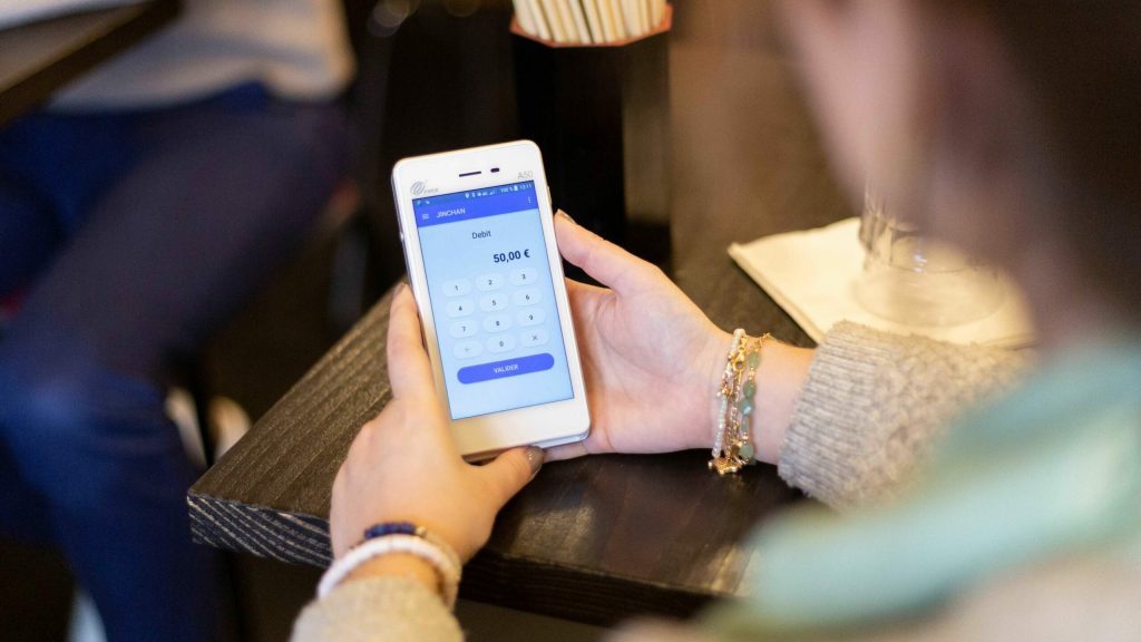 Transaction volume processing costs comparison showing merchant handling card payment terminal