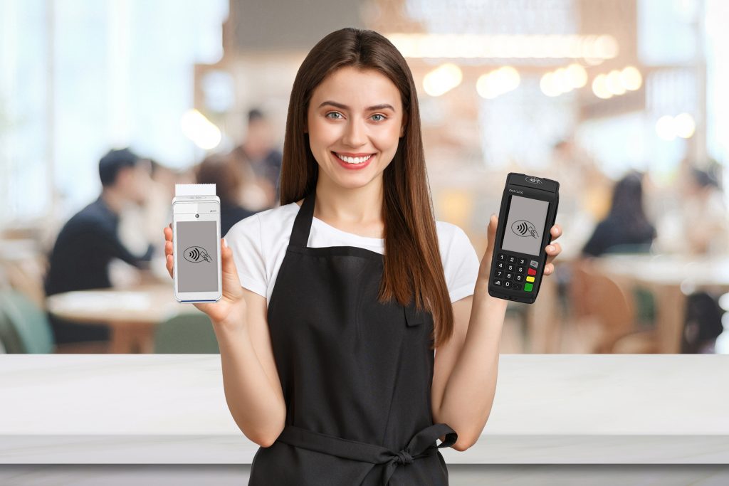 Card terminal comparison Ireland showing waiter using traditional and mobile card machines for restaurant payments