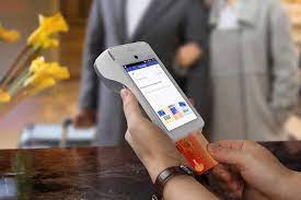 Payment processing fee comparison showing customer making contactless transaction in Irish store