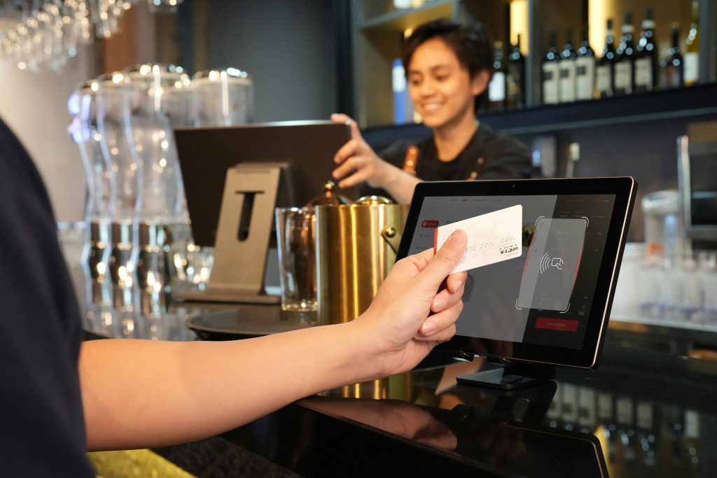Retail merchant services comparison showing contactless payment on integrated EPOS system