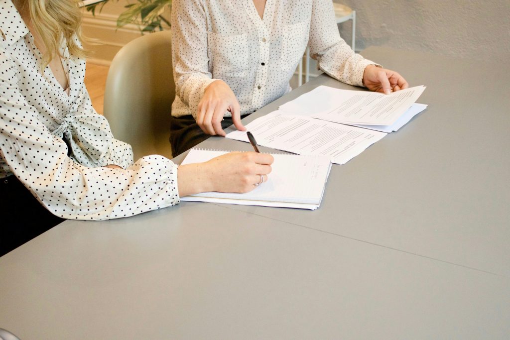 Business owner signing contract with early termination fees Ireland clause - avoid merchant service penalties Compayre.ie