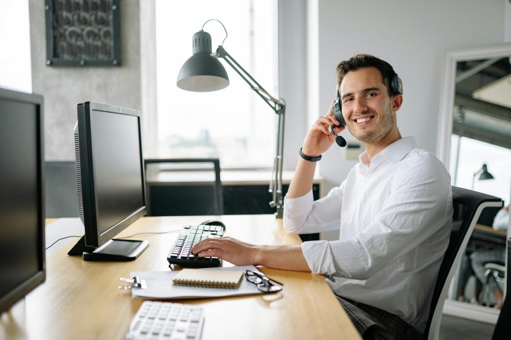 Customer support man smiling payment provider support Ireland merchant services support comparison Ireland
