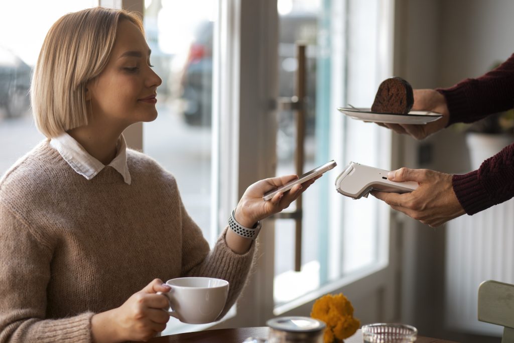 Customer making contactless payment on PAX A920 PRO terminal with payment backup systems Ireland UPS and 4G connectivity