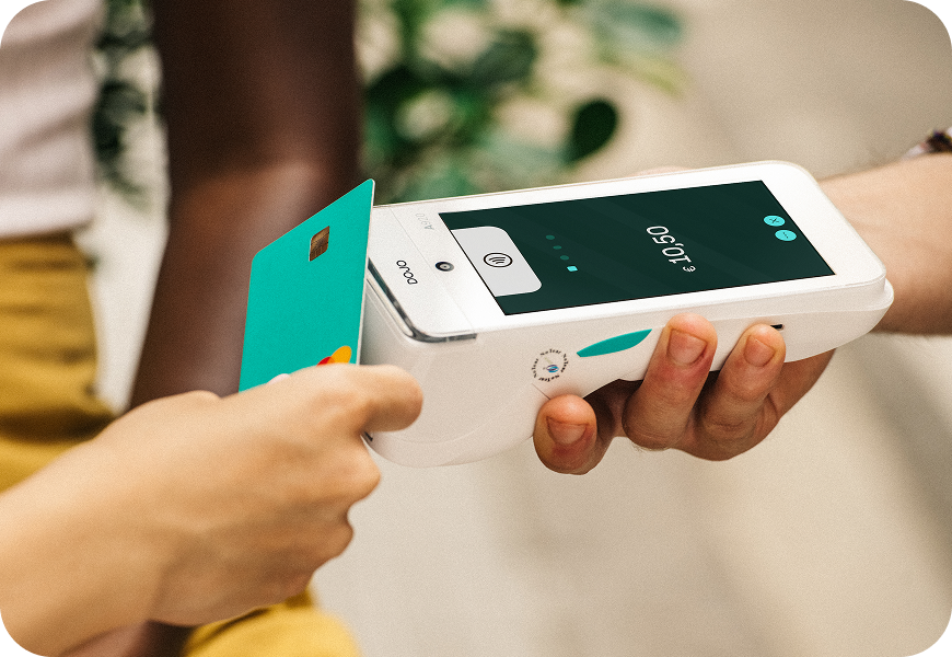 Person making a contactless payment on a Dojo card machine in Ireland